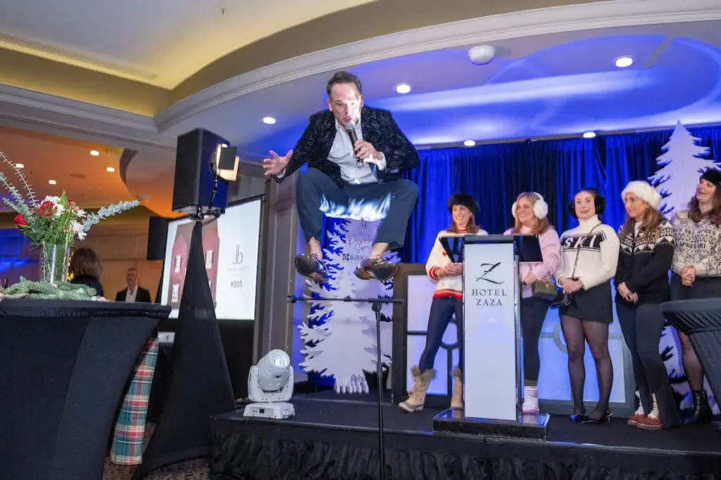 Johnny Holliday jumping into action for the La Petite Maison live auction (Photo by Jacob Power)