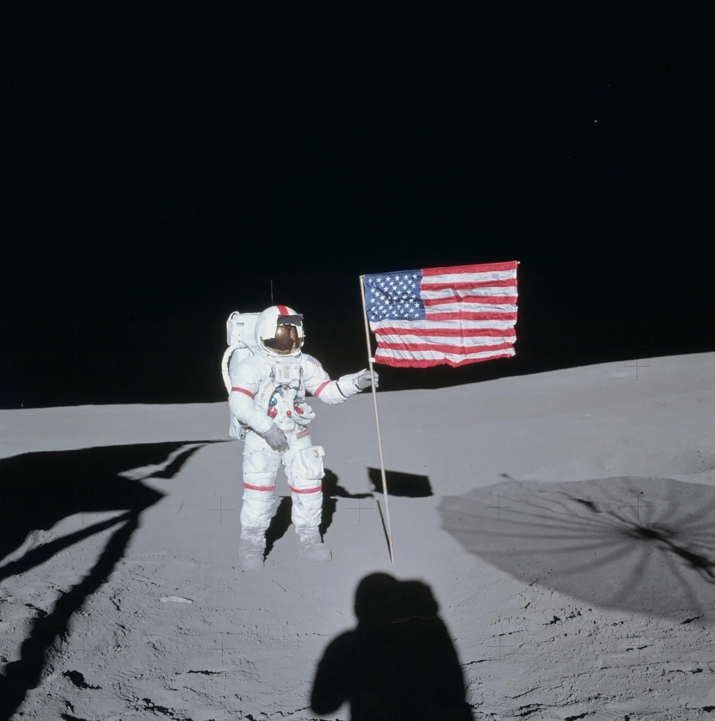 Apollo 14 commander Alan Shepard stands on the moon with an American flag on February 5, 1971. (Photo courtesy of Barbara Radnofsky)