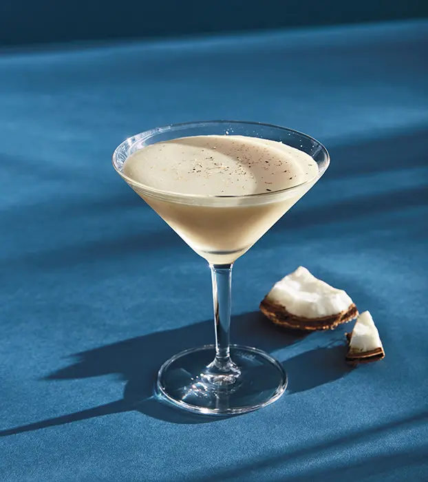 Savor the tropical twist of Tommy Bahama’s Coconut Eggnog Martini, a perfect holiday blend of bourbon, coconut rum and homemade eggnog. (Photo courtesy Tommy Bahama)