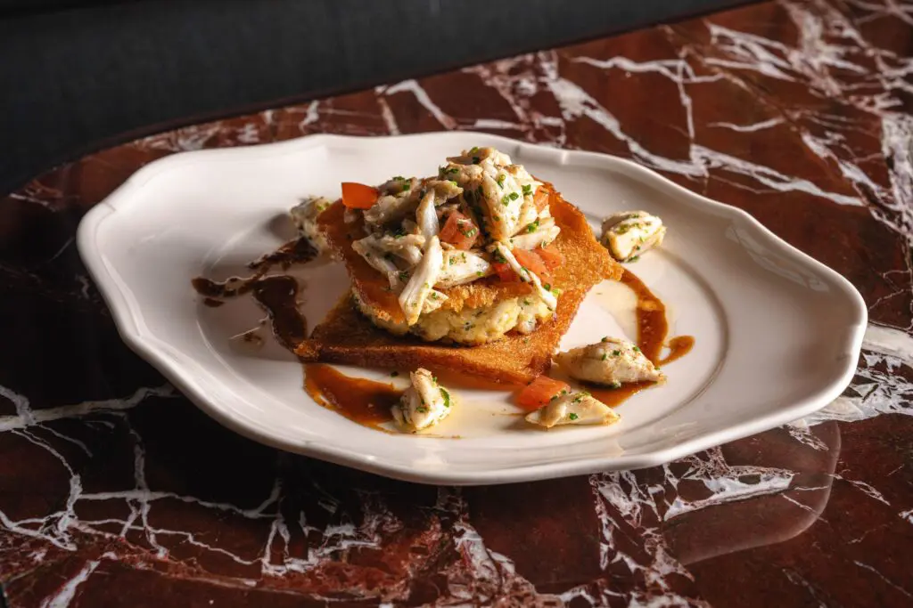One of the new menu additions include the crab Napoleon layered with milk bread, tomato, and tamarind ($33). (Photo by Michael Anthony)