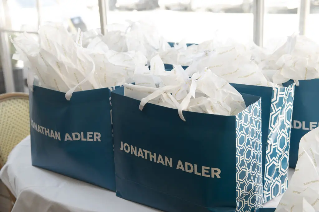 Guests' gift bags included a ceramic canister that resembled a dollop of meringue. (Photo by Tamytha Cameron Photography)