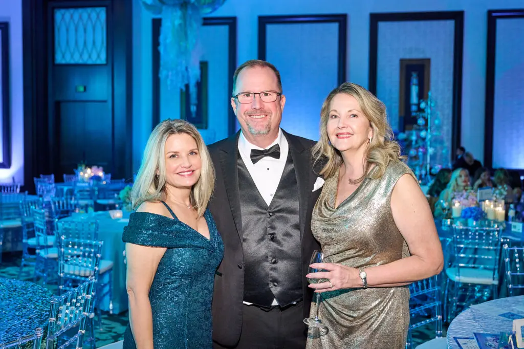 Laura Miller, Evan & Stacy Powell at the Spindletop Community Impact Partners 50th annual Holiday Ball (Photo by Fulton Davenport/PWL Studio)