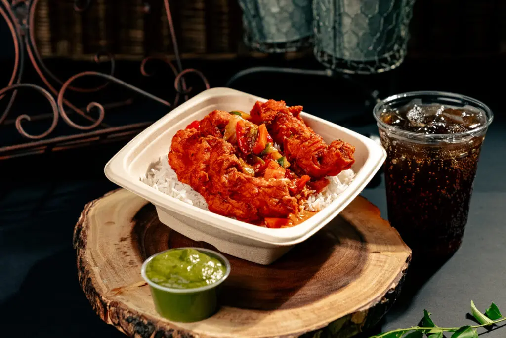 The Loaded Rice & Shine ($11.99) at Pok Pok Po combines steamed basmati rice (made every four hours to ensure its freshness) with crispy chicken thigh or breast, house-made sauce, and desi kimchi. (Photo by Alex Montoya)