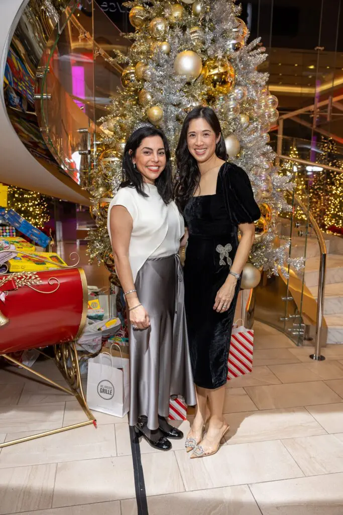 Nicole Katz, Carolyn Sabat at the Ambassadors for Texas Children's Hospital holiday party. (Photo by Jenny Antill)