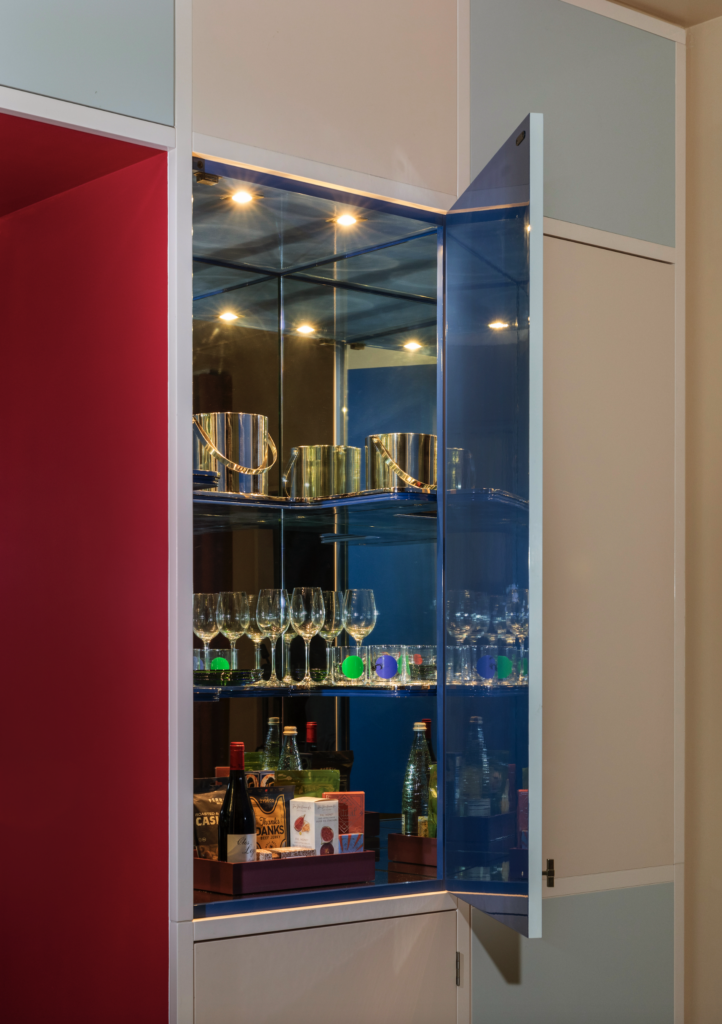 The cabinet bar with an Yves Klein blue interior is a reference to the de Menils' own drinks cabinet (Photo by Julie Soefer)