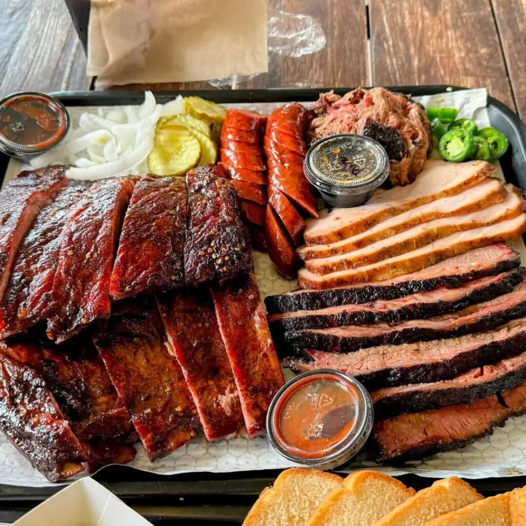 A platter of meats and sausages from Corkscrew BBQ shows its Michelin star-worthy power.