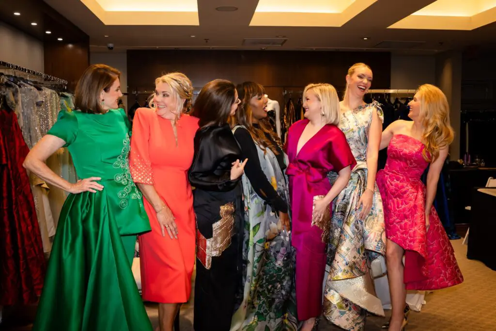 American Heart Association Circle of Red celebrity models having a ball with designer Nardos Imam before the Elizabeth Anthony fashion show. (Photo by Christina Griffin)