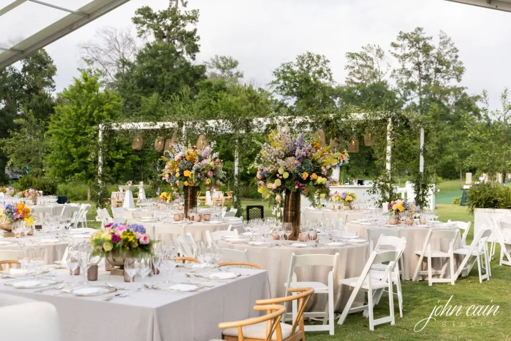 Magnificent florals and views to the forest set the stage for the wedding reception and dinner.  (Photo by John Cain)