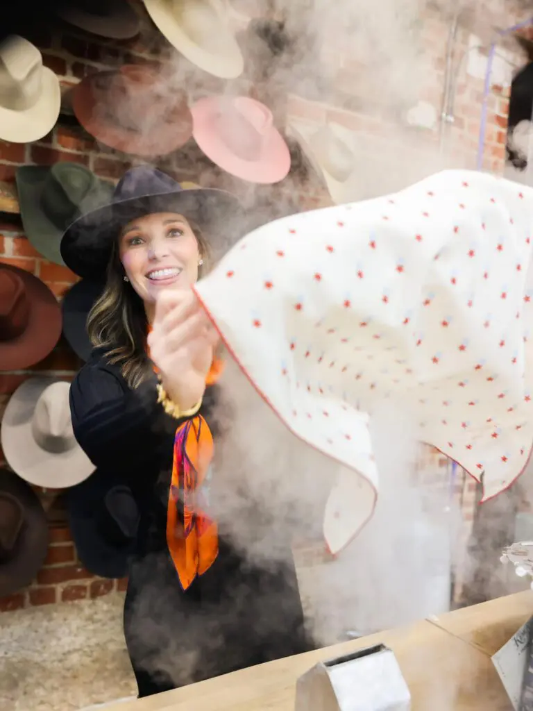 Dozens of Wild Silks fans packed Kemo Sabe recently to view and buy scarves designed and sold by Christi Brasswell (shown here) and Katie Murray. (Courtesy)