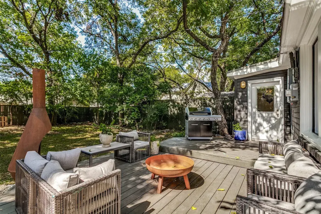 At 1023 North Edgefield Avenue, the backyard has a deck perfect for entertaining guests. 