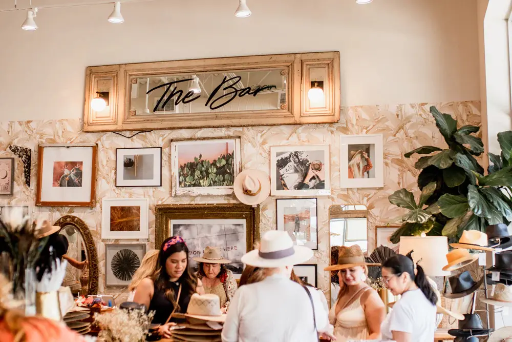 By design, the entire experience at Flea Style, which operates North Texas locations in Dallas, Frisco, Fort Worth, and Prosper, feels like a party. Each hat bar reservation includes a Ranch Water, and groups are welcome. (Photo courtesy of Flea Style)