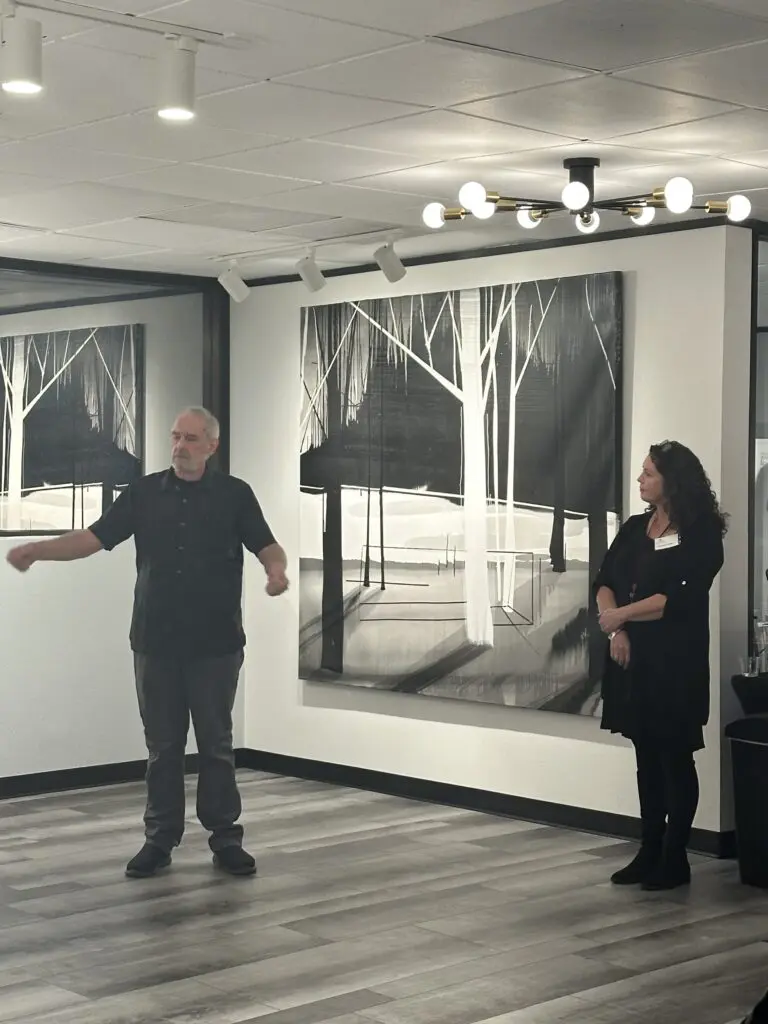 Martin Amorous described how working with large panels works, with exhibit curator Annette Palmer at The Woodlands Arts Council's space.