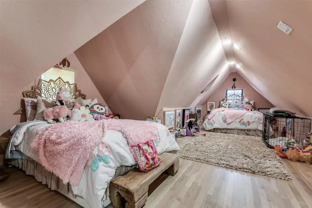 The additional bedrooms provide flexibility "for any lifestyle," though the current set-up seems ideal. (What little girl didn't dream of a lofted bedroom up a spiral staircase, reading with her legs propped up against the slanted ceilings?)