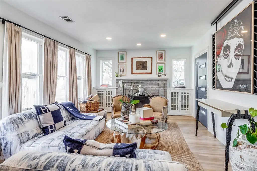 On quiet nights, read in the living room as a fire roars in the original fireplace at 1023 North Edgefield Avenue.