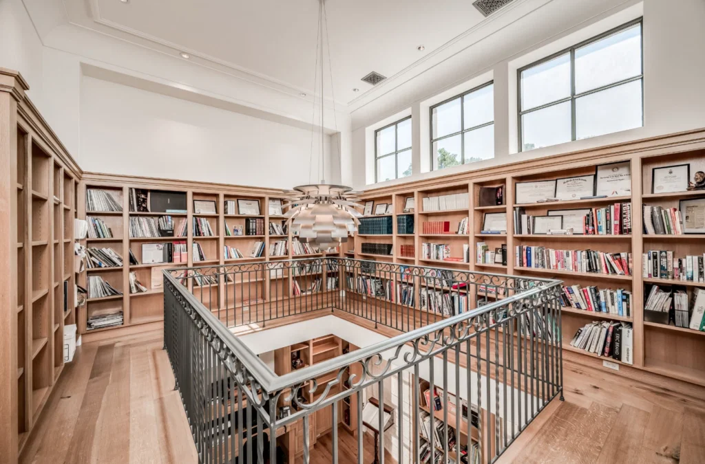 The two-story library at 119 Carnarvon Drive is a rare amenity in today's homes. (Photo by Patrick Bertolino for Martha Turner Sotheby's International Realty)