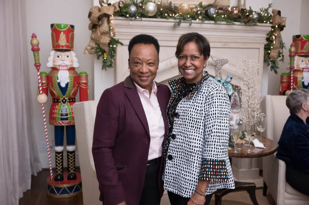 Sharon Land, Linda Gibbs at Legacy Community Health's Holiday Schmooze. (Photo by Daniel Ortiz)