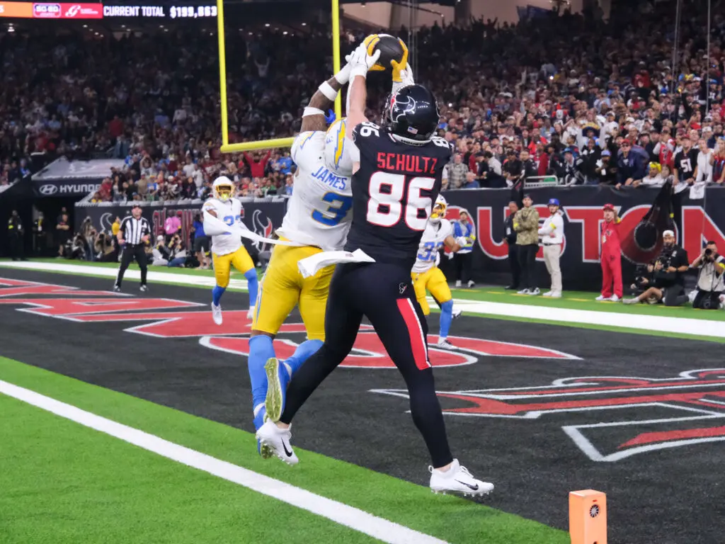 Houston Texans tight end Dalton Schultz battled Chargers safety Derwin James but James won this battle. Only to see his interception overturned by replay review. (Photo by F. Carter Smith)