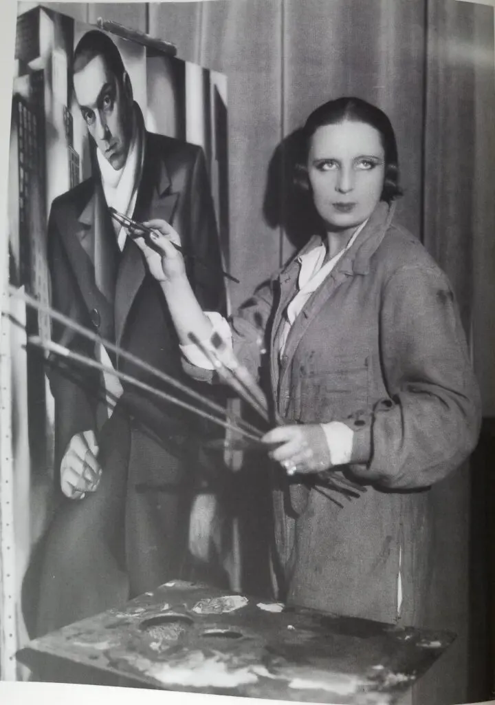 Tamara de Lempicka working on "Portrait of a Man (Tadeusz Lempicki)," circa 1929. (From the book Tamara de Lempicka by Gioia Mori and Furio Rinaldi, Yale University Press © 2024. Bibliothèque historique de la Ville de Paris. Photo by Thérèse Bonney.) 