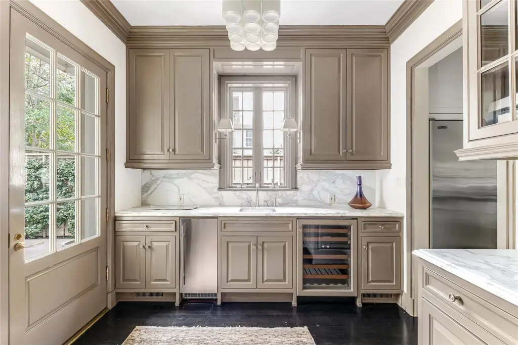 Ideal for entertaining, the kitchen includes a commercial-grade range and a butler's pantry for additional storage. (Photo by Allie Beth Allman & Associates)