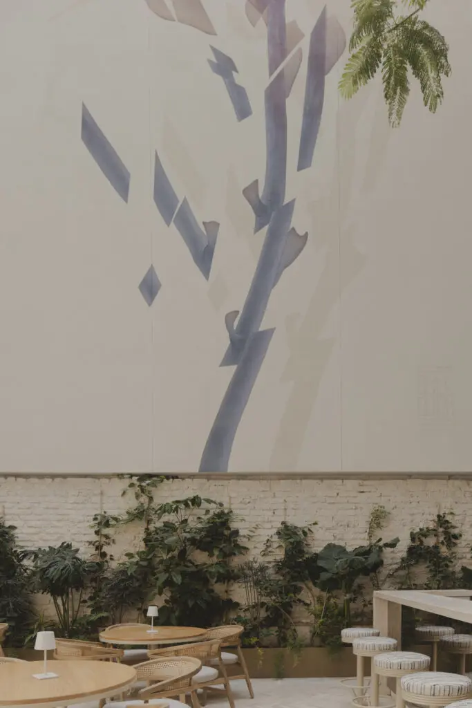 A mural by James Burrough is the focal point of the chic atrium eatery Aquiles right off the lobby of Casona Roma Norte. 