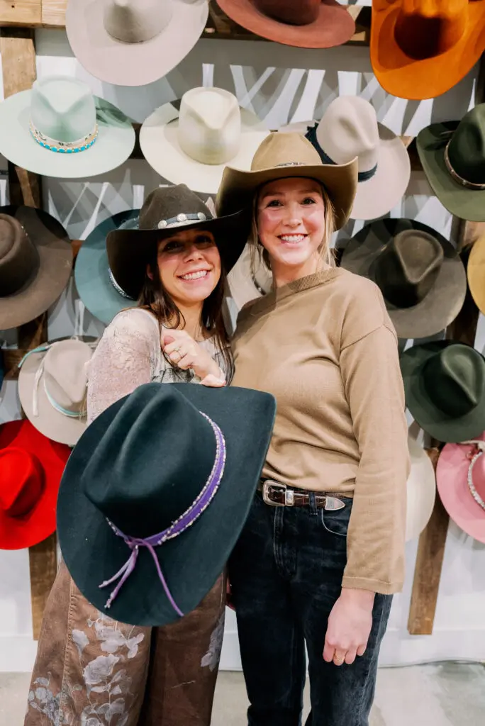 Alix Bersani, Haley Sarasin show off their Kemo Sabe custom cowboy hats. (Photo by Nan Studios)