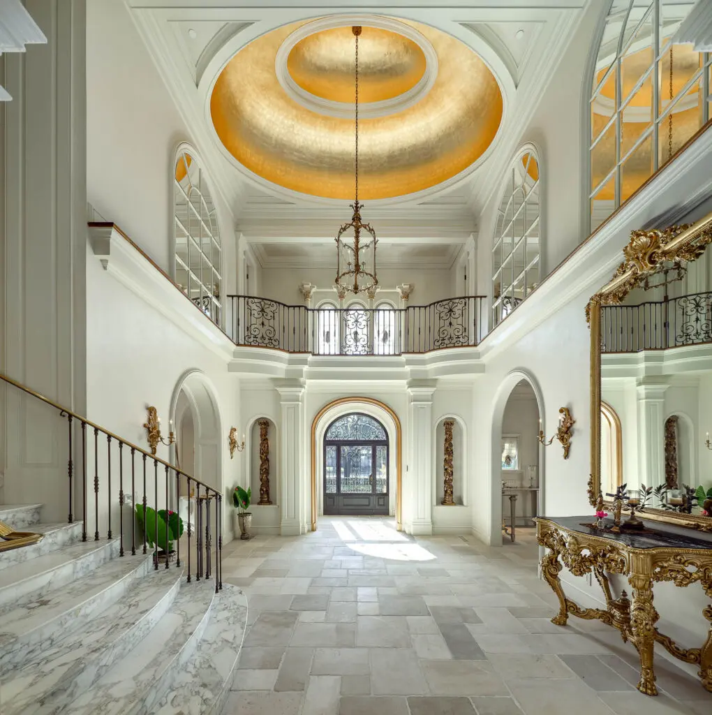 The soaring ceilings of the grand foyer highlight a ceiling dome adorned with 24-karat gold leaf. (Photo by Briggs Freeman Sotheby's International Realty)