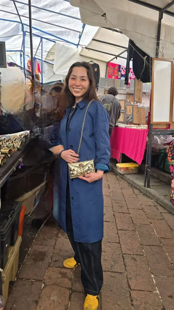A happy customer showcasing her new handcrafted bag, a perfect blend of tradition and artistry that makes each piece one-of-a-kind. (Photo courtesy Gabriela Torres Zaragoza)