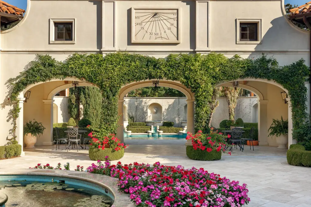 More than an acre of landscaped grounds, filled with azaleas and towering live oaks, transport guests outside of Dallas to the European destinations that inspired much of the design. (Photo by Briggs Freeman Sotheby's International Realty)