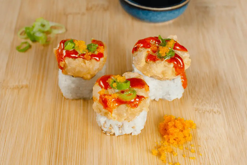 For something bold, try the Spicy Popcorn Shrimp Roll at Kura Revolving Sushi Bar. (Courtesy)
