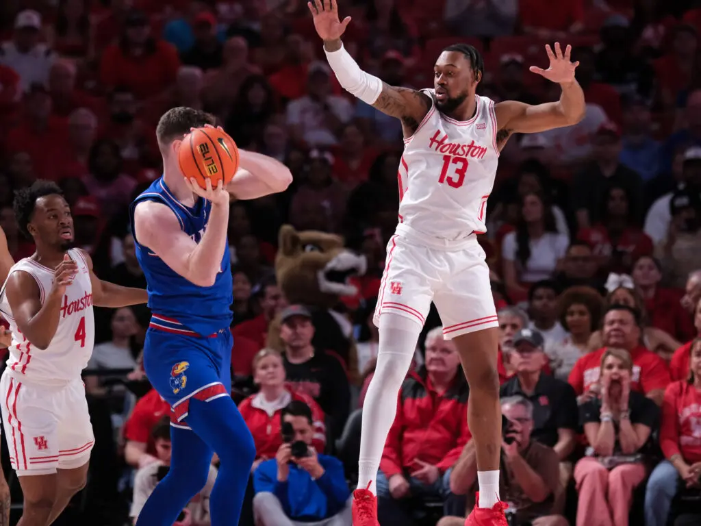 University of Houston forward J'Wan Roberts and UH's defense gave Kansas star Hunter Dickinson all kinds of trouble. (Photo by F. Carter Smith)