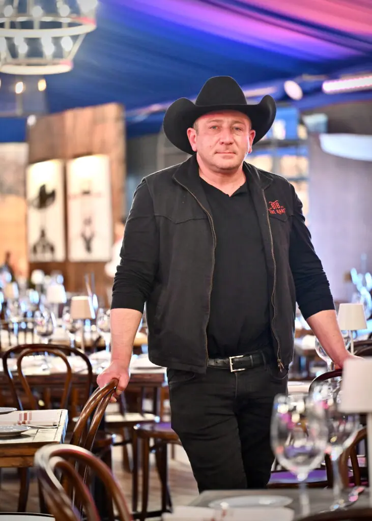 Ben Berg ready for the rodeo inside his Ranch Saloon + Steakhouse (Photo by Alex Montoya)