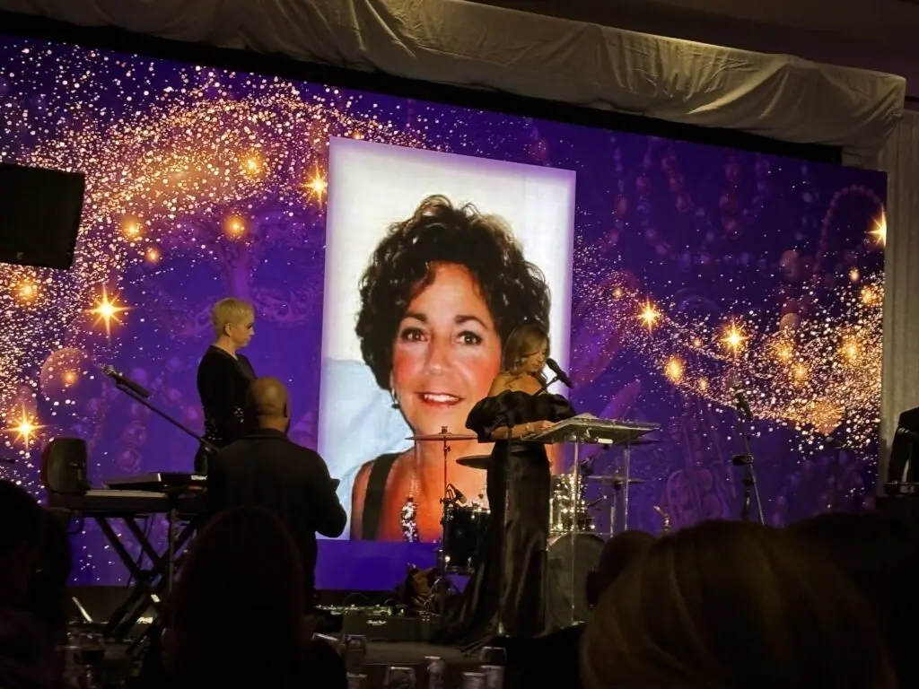 A speaker shares a tribute at the 2025 Memory Ball on March 1 at The Woodlands Waterway Marriott. (Photo by Laura Landsbaum)