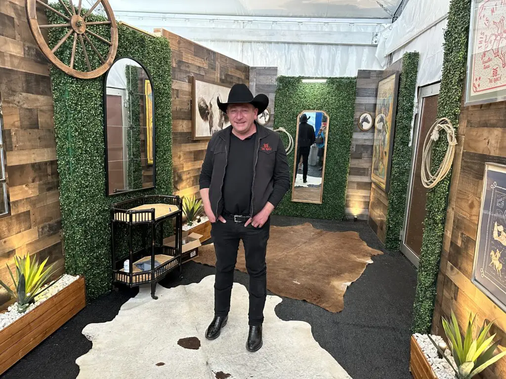 Ben Berg shows off the new restroom at The Ranch + Steakhouse (Photo by Shelby Hodge)
