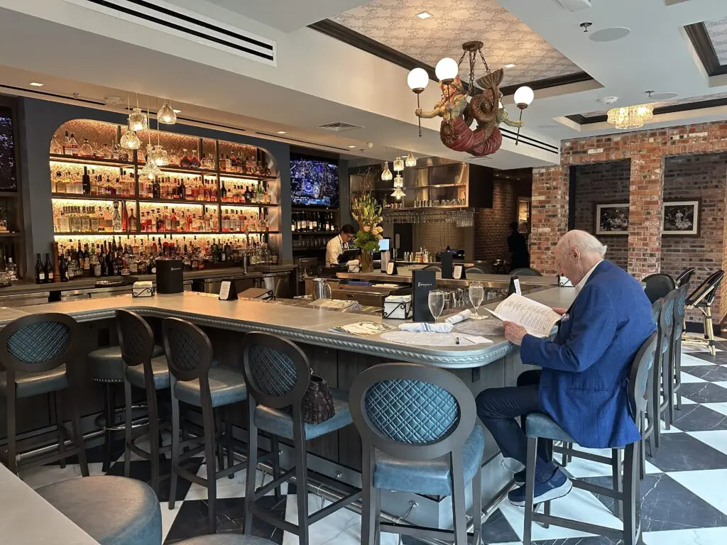 The expanded Courtyard Bar at Brennan's Houston where the zinc bar is prominent. 
