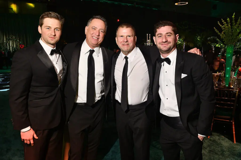 Patrick Fertitta, Richard Handler, Tilman Fertitta, and Handler's son at the San Luis Salute (Photo by Dave Rossman)