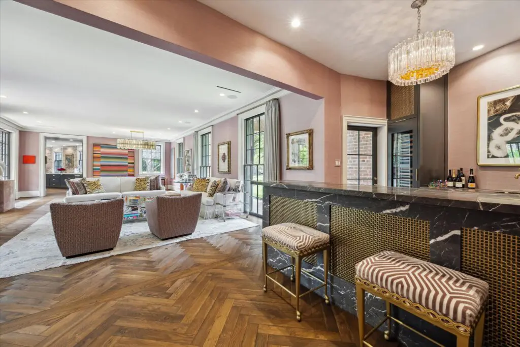 Updates to the original home at 3 Remington Lane include a wet bar and expansive family room. (Photo by TK Images)