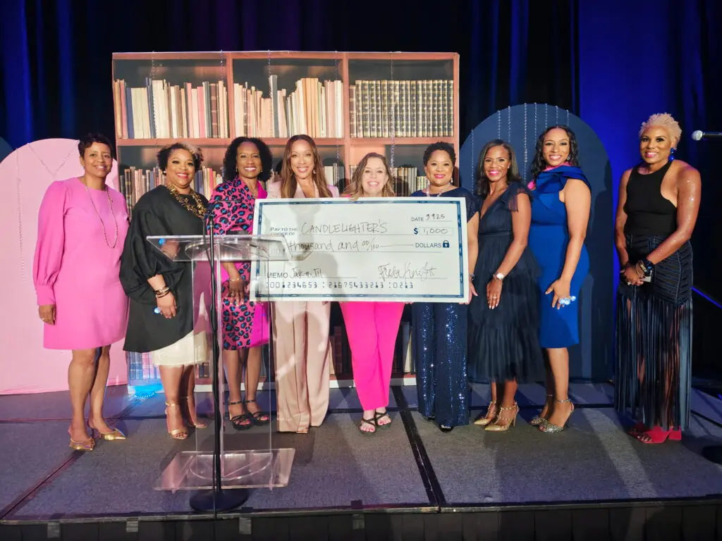 Community Service Chair Nakedra Campbell, Member-at-Large Michon King, Regional Treasurer Jennifer Jackson, Chapter President Freda Knight, a representative from Candlelighters, National Recording Secretary Vanessa LaFleur, and Foundation Chairs Natashia Douglas, Shavonne Spencer, and Nikki Branch with the donation check to Candlelighters during Jack and Jill’s 2025 Pink and Blue gala at The Woodlands Resort. (Photo by 209 Photo Booth)