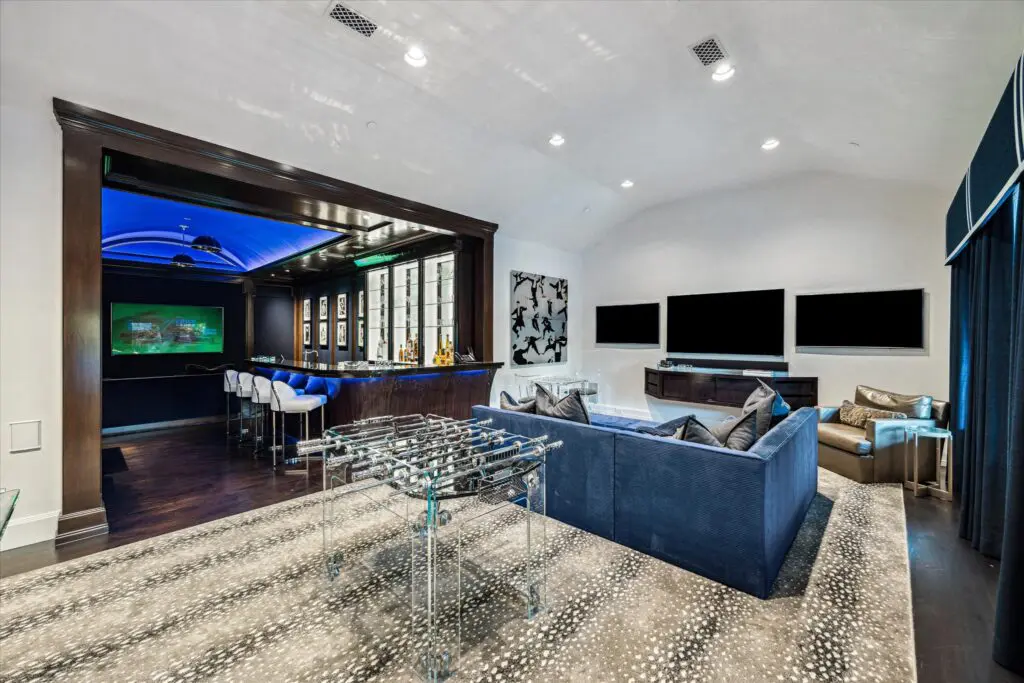 Multiple TVs add entertainment value to the second floor game room (Photo by TK Images)