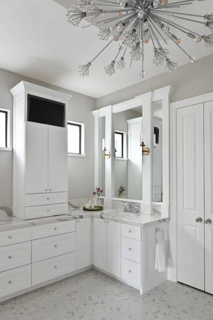 The entirely new primary bath is thoughtfully designed with abundant storage. (Photo by Charbonneau Interiors)