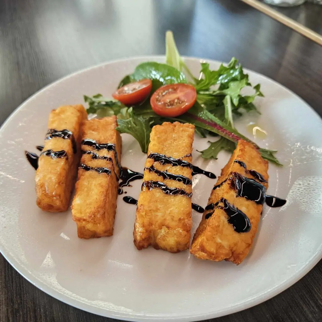 The fried halloumi at Karino's comes topped with drizzles of balsamic vinegar for a rich, salty, and delicious experience. (Photo by Edward Brown)