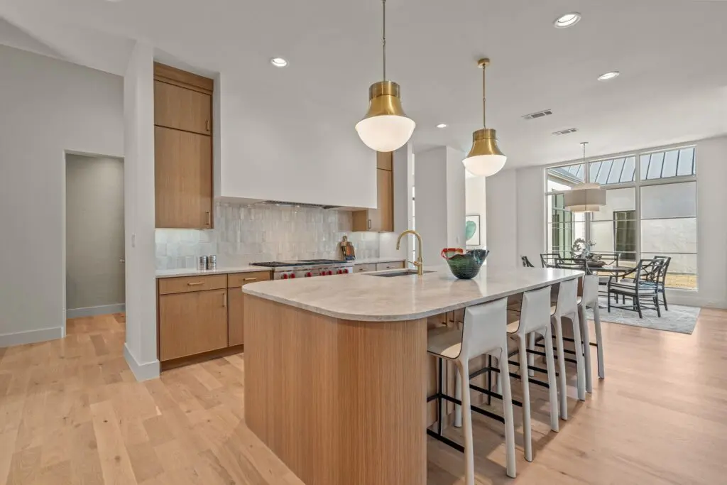 The kitchen at 9825 Loire Valley Trail balances beauty and function with a separate prep space and upscale appliances. (Courtesy)
