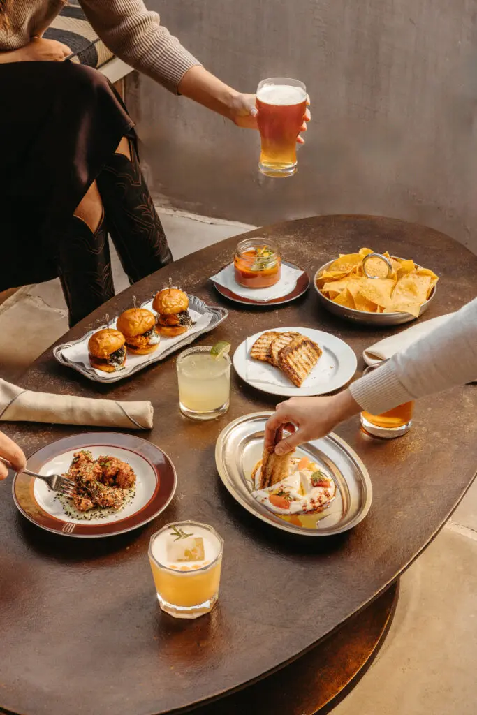 From the walk-in-only menu, try the Whipped Feta Toast with harissa and Medjool date, or the Fire Roasted Corn topped with chermoula, Aleppo, and crumbled feta. (Courtesy)