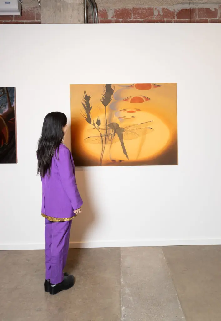 An attendee admires a piece in the 2025 Dallas Art Fair (Photo by Exploredinary)