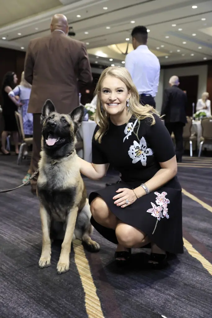 Special honoree US Marshall Service K9 Rocky, honoree Frances Moody Buzbee at Crime Stoppers of Houston's 'Houston Heroes' award luncheon.  (Photo by Quy Tran)