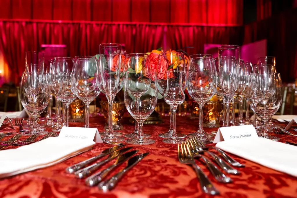 Multiple wine glasses indicate the wine servings to come at the  Houston Symphony Wine Dinner & Collector's Auction (Photo by Priscilla Dickson)