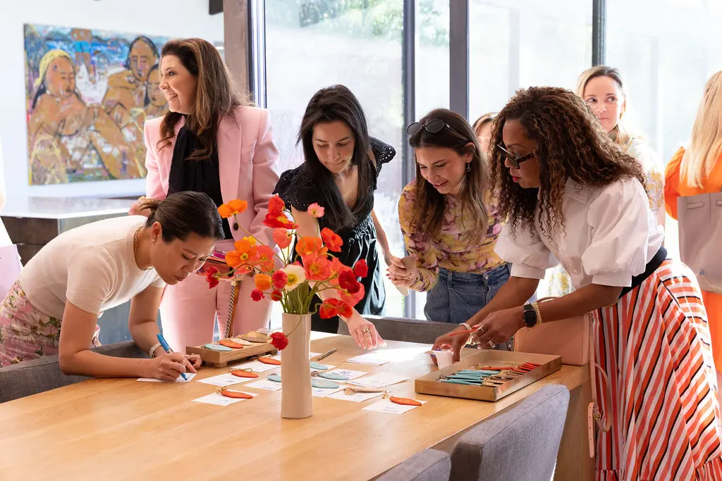 Leatherology was onsite customizing leather keychains that featured Madeline Donahue's artwork with guests' monograms. (Photo by Kaitlin Saragusa Photography)
