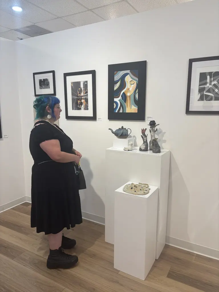 Dean Abilez stands beside her ceramic stingray and other works featured in "Lone Star Rising" at Ardest Gallery. (Photo courtesy Ardest Gallery)