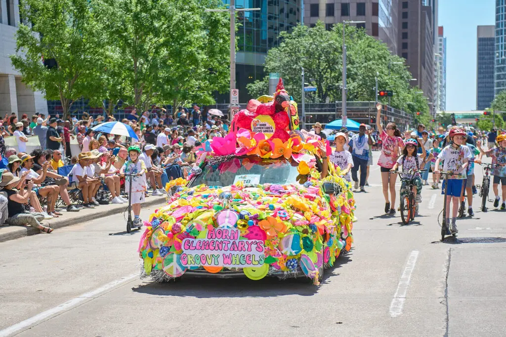 Horn Elementary & Debbie Guelzow's Groovy Wheels at The Orange Show 38th Annual Art Car Parade (Photo by Charlie Ewing)