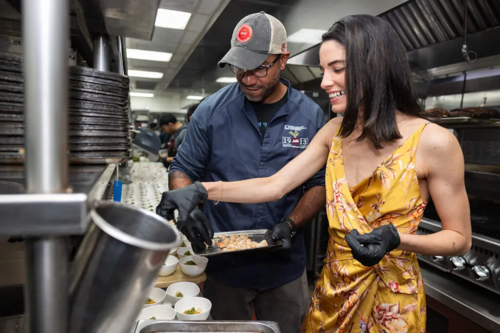 Chef Chris Williams and Estheysis Menendez put finishing touches on their dish; Photo Credit Melissa Taylor.jpg (Photo by Melissa Taylor)