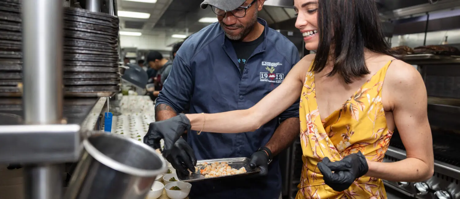 Chef Chris Williams and Estheysis Menendez put finishing touches on their dish; Photo Credit Melissa Taylor.jpg (Photo by Melissa Taylor)
